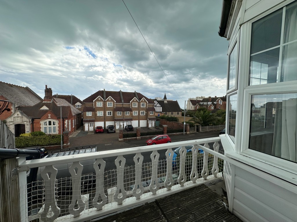 Lot: 57 - THREE-BEDROOM FIRST FLOOR FLAT WITH FRONT GARDEN & BALCONY - Balcony and the view from the balcony